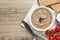 Flat lay composition with tasty liver pate on wooden table. Space for text