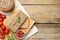 Flat lay composition with tasty liver pate on wooden table. Space for text