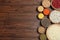 Flat lay composition with types of legumes and cereals on wooden table, space for text. Organic grains