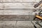 Flat lay composition with vintage carpentry tools on rough wooden background. Top view workbench with carpenter different tools.