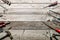 Flat lay composition with vintage carpentry tools on rough wooden background. Top view workbench with carpenter different tools.