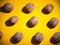 Flat lay composition with walnuts on yellow background.