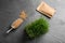 Flat lay composition with wheat grass, paper bag and grains