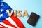 Flat lay composition with word VISA, passport and flag of USA