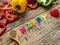 Flat lay of cooking utensils with herbs , colorful bell pepper