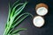 Flat lay cracked coconut and green aloe vera plant leaves
