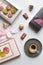 Flat lay with cup of espresso, bonbons, chocolate and coffee capsules