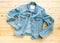 Flat lay, Denim jacket jeans mockup on brown wooden background. Template