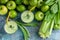 Flat lay detox smoothie. Green apples, celery, ramson and limes on a concrete background. Detox program, diet plan, weight loss