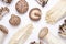 Flat lay of different edible mushrooms on white background close-up.