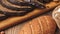 Flat Lay of different kinds of organic bread isolated on wooden table