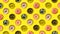 Flat lay of different multi colored glazed and sprinkled donuts on yellow background