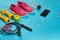 Flat lay of dumbbell, bottle of water, jump rope and sneaker, sport equipments, fitness items, top view
