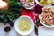 Flat-lay of festive table setting for holiday dinner with dishes. Traditional Italian Christmas dinner - tortellini with broth,