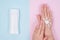 Flat lay flatlay top above high angle overhead close up view photo of lady applying cream on hand isolated on pastel pink blue bac