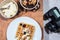 Flat lay food photography. Table top breakfast meal with camera