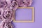 Flat lay with frame and artificial flower christmas decoration on purple background