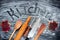 Flat lay with fresh word kitchen written with flour on black kneading table. Cooking, kneading dough for baking