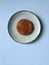 Flat lay of fried veggie burger, cutlet on a blue plate close up. Fork and knife. Dinner. Restaurant menu. Copy space.