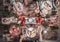 Flat-lay of friends hands eating and drinking together. Top view of people having party