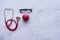 flat lay of good healthy concept,  red heart and stethoscope and table on white marble background