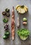 Flat-lay of healthy fresh vegetables, fruits, greens, bread and sausage