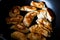 Flat lay image above traditional polish meal pirogi in the frying pan on the table. Delicious dough meal prepared on old