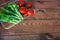 Flat lay. Kitchen table with lettuce and red tomatoes. Copy space