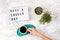 Flat lay with lightbox with text Have a lovely day and coffee cup. Social media, motivation quote, feminine blog, morning of