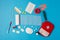 Flat lay Medicines and devices for first aid, bandages, painkillers, plaster, cotton wool, tampon