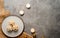 Flat lay of mince pies served on a dish and burning candles