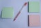 flat lay mock up green and pink sticky note with pen for message