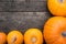 Flat lay, orange Pumpkins on a wooden Table, copyspace