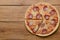 Flat lay pepperoni pizza  on rustic wooden background. Pizza salami cut in slices. Fast food, junk food concept.