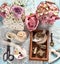 Flat lay photo with old laces and miniature iron objects in wood