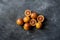 flat lay of red sliced exotic oranges, dark food on black surfaces