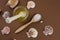 flat lay sea salt spoon ,honey jar and sea shells brown background copy space