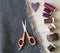 Flat lay of sewing equipment on linen background