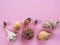 Flat lay of shells and sea urchin on pink background with space for text. Concept of summer holidays, vacation. Picture for travel