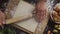 Flat lay shot: chef rolls out the dough with a rolling pin on the kitchen table, table top of the rolling out the puff