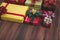 Flat lay shot of coloful boxes with colorful ribbon on wooden ba