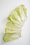  flat lay shot of a pile of Chinese napa cabbage leaves on a white background
