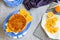 Flat lay of Sicilian whole orange cake with orange slices on a cooling rack,purple napkin. Christmas,Thanksgiving cake.