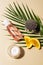 flat lay with skin care products green palm leaf and orange slices with water drops