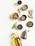 Flat lay of small bowls various dry spices and olive oil in glass bottle on light background. Top view. copy space