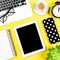 Flat lay social media notebook screen coffee yellow background