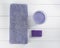 Flat lay spa bath on white wooden background, top view products for hygiene. Candle and handmade soap lavender with towel