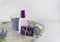 Flat lay spa bath on white wooden background, top view products for hygiene. Candle, handmade soap lavender and tube