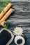 flat lay with spa and massage treatment arrangement with towel, essential oil, pebbles and chrysanthemum flower