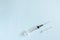 Flat lay sterile syringe with a needle on a white background. treatment, prevention, laboratory, infection.